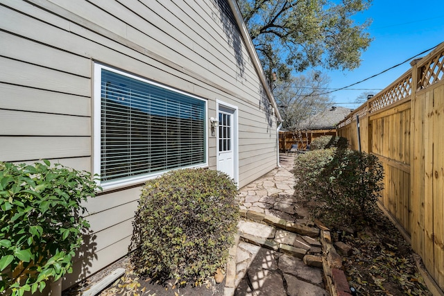 view of property exterior with a fenced backyard