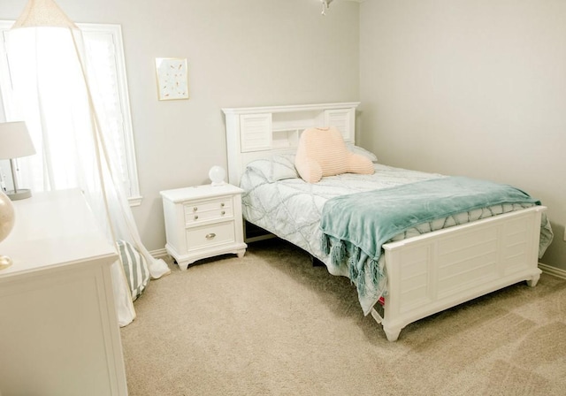 bedroom with light carpet