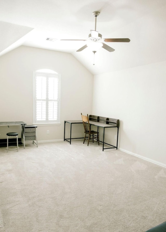 office space with lofted ceiling, carpet, visible vents, and baseboards