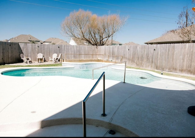 view of swimming pool with a fenced in pool, a patio area, and a fenced backyard