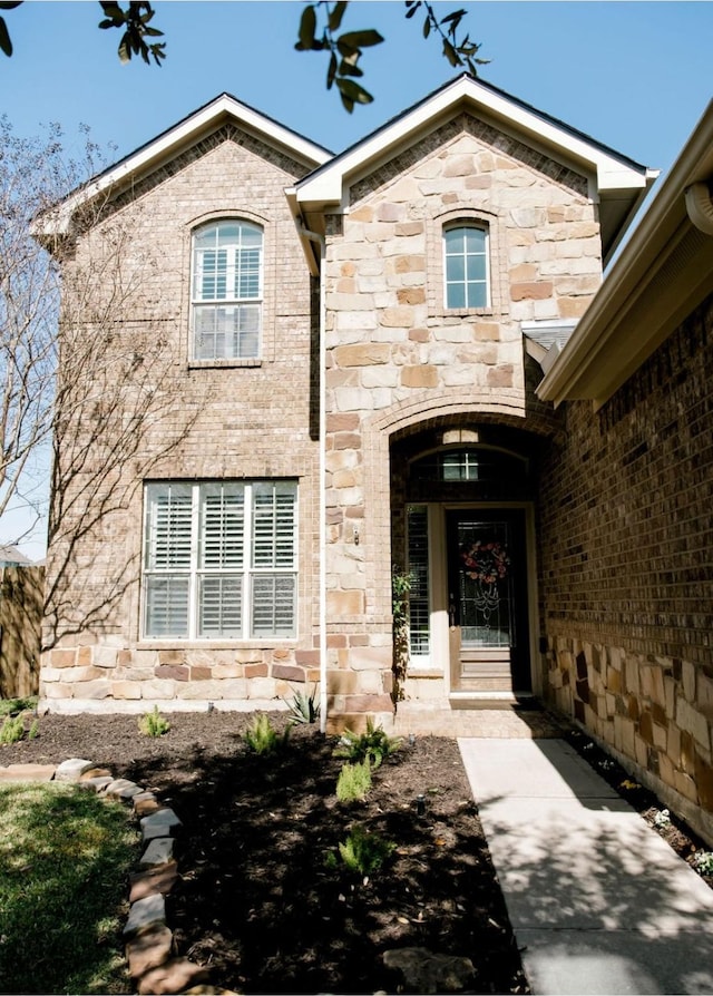 entrance to property with stone siding