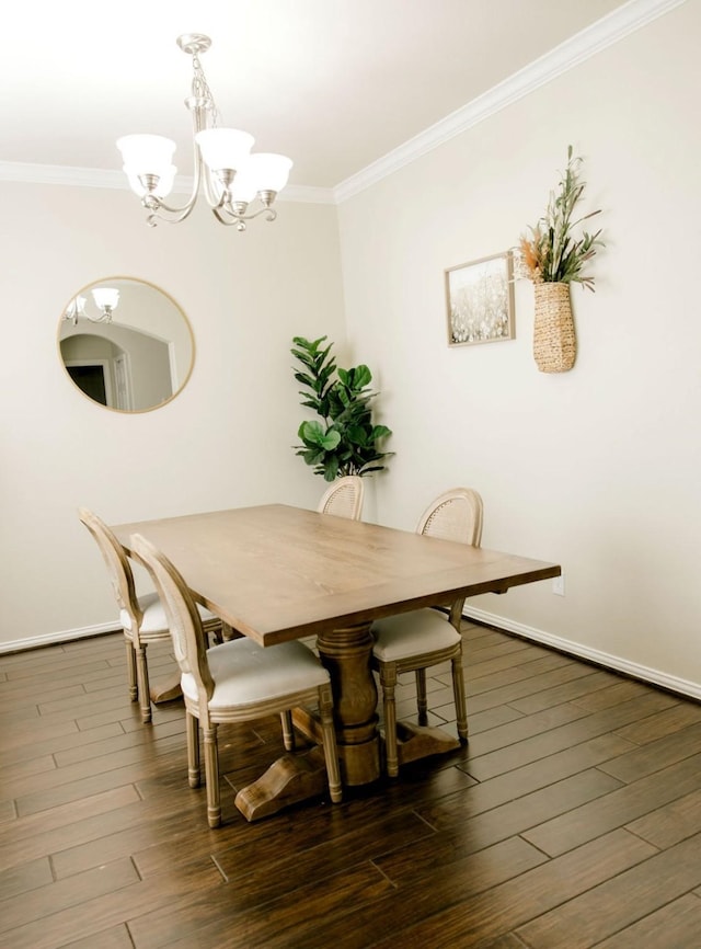 dining space featuring baseboards, ornamental molding, a chandelier, and dark wood-style flooring