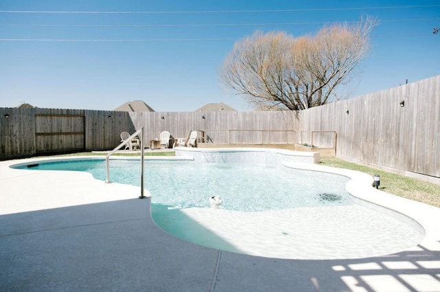 view of swimming pool with a fenced in pool, a fenced backyard, and a patio