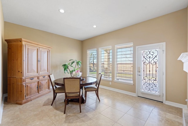 dining space featuring light tile patterned flooring, baseboards, and recessed lighting