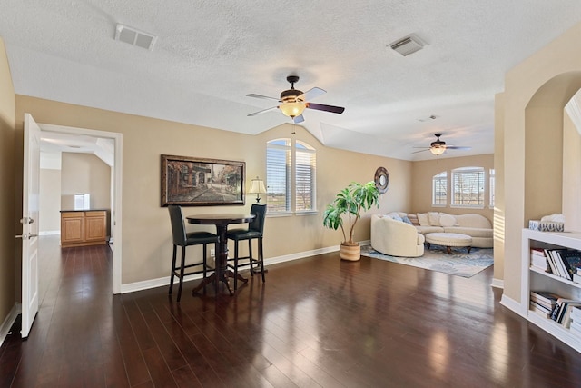 dining area featuring a wealth of natural light, visible vents, and wood finished floors