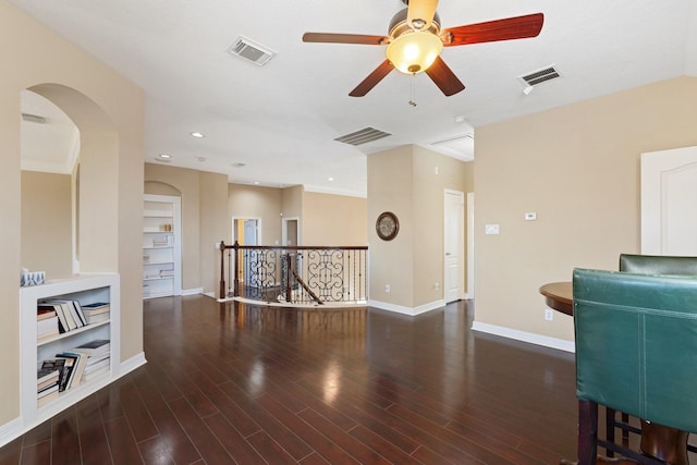 interior space with visible vents, baseboards, and wood finished floors