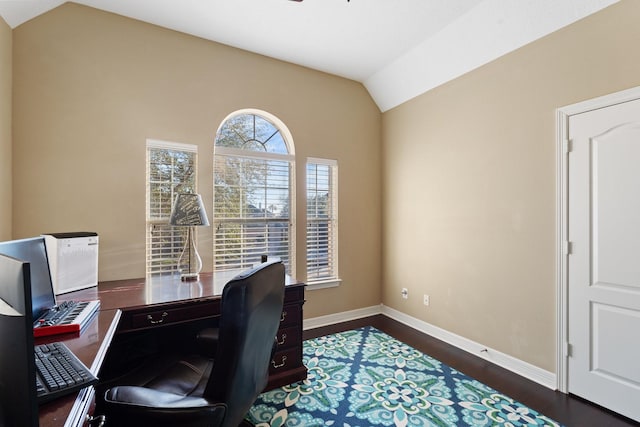 office area featuring lofted ceiling, dark wood-style floors, and baseboards