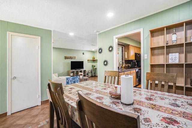 dining area featuring light tile patterned floors