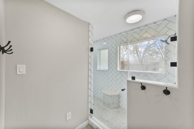 bathroom with a tile shower