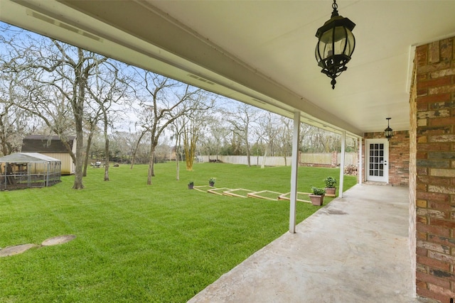 view of yard featuring a patio and fence