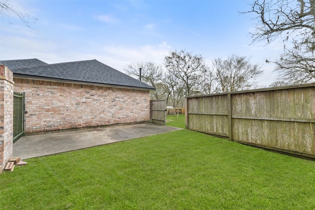 view of yard featuring a patio and fence