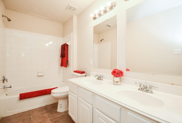 full bath featuring  shower combination, visible vents, a sink, and toilet