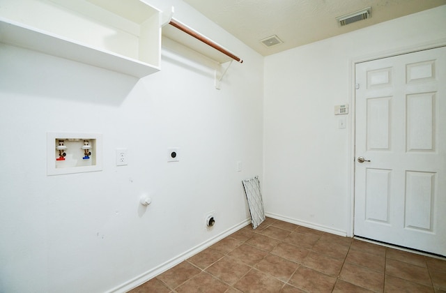 laundry room with hookup for a washing machine, visible vents, hookup for an electric dryer, laundry area, and tile patterned floors