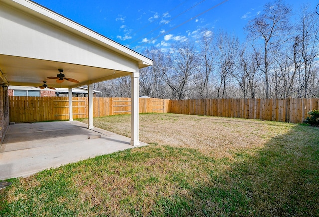 view of yard featuring a fenced backyard, a ceiling fan, and a patio
