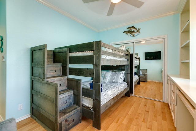 bedroom with baseboards, light wood-type flooring, and crown molding