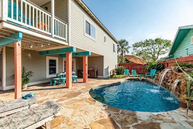 view of pool featuring a patio area, fence, and a fenced in pool