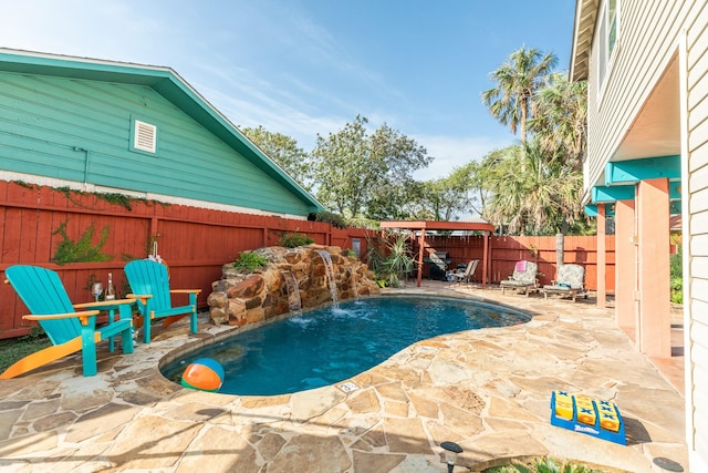 view of swimming pool with a patio area, a fenced backyard, and a fenced in pool