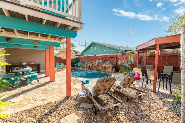 view of patio / terrace featuring a fenced backyard and a fenced in pool