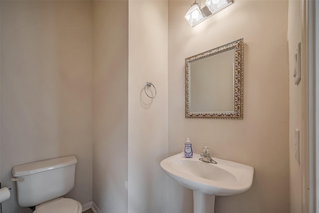 bathroom featuring a sink and toilet