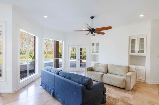 living area with recessed lighting, visible vents, ornamental molding, and french doors