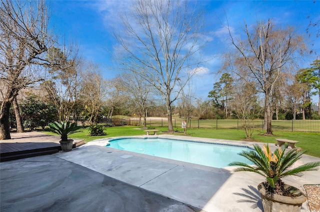 view of swimming pool featuring a patio area, a fenced in pool, fence, and a lawn