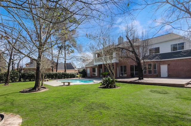 view of yard featuring an outdoor pool and a wooden deck