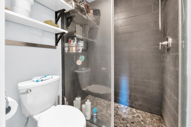 full bathroom with a shower stall and toilet