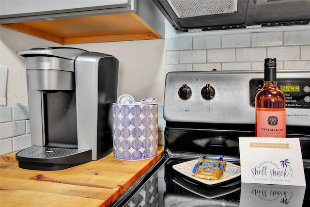 room details featuring electric range and butcher block countertops