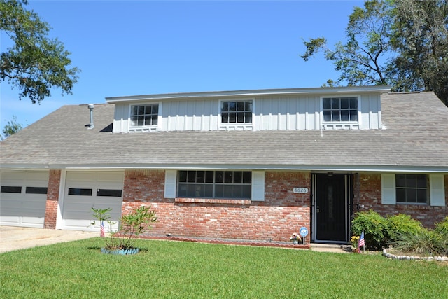 view of front of home featuring an attached garage, brick siding, concrete driveway, roof with shingles, and a front yard