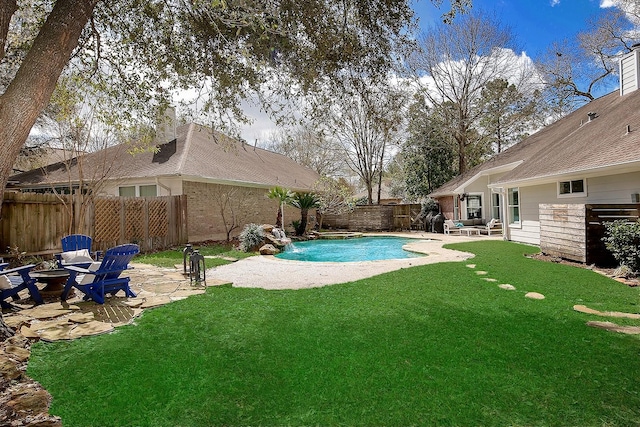 view of pool featuring a fenced in pool, a lawn, a fenced backyard, and a patio area