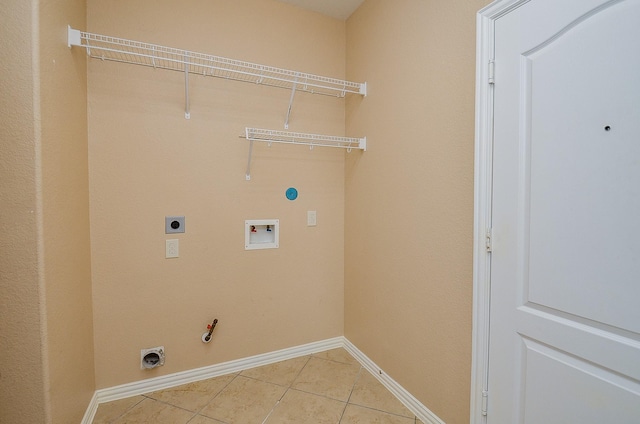 laundry room with washer hookup, hookup for a gas dryer, light tile patterned flooring, electric dryer hookup, and laundry area