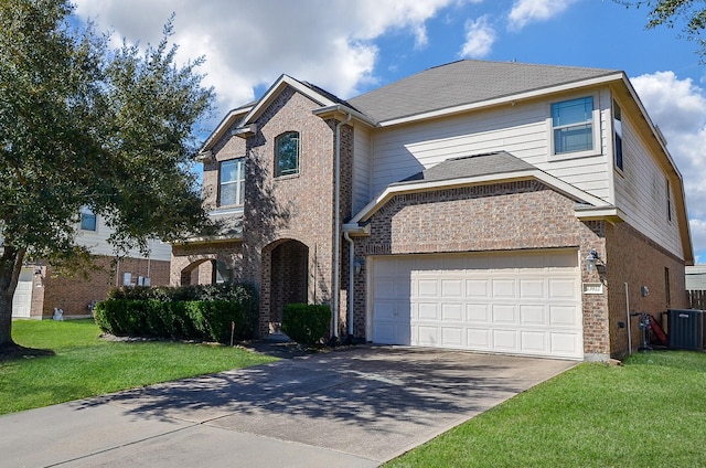 traditional home with brick siding, an attached garage, a front yard, cooling unit, and driveway