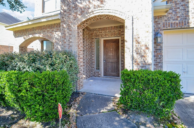 property entrance with brick siding