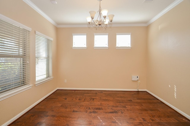 spare room with an inviting chandelier, crown molding, baseboards, and dark wood-type flooring