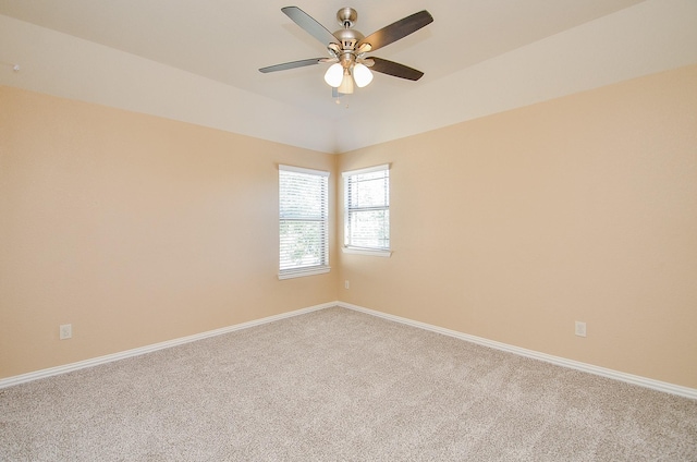 unfurnished room featuring ceiling fan and carpet flooring