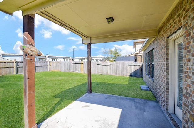 view of yard with a patio area and a fenced backyard