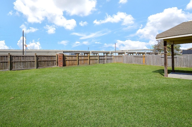 view of yard featuring a fenced backyard