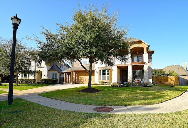 10010 Friesian Estates Dr, Spring, TX 77379 - view of property hidden behind natural elements featuring concrete driveway, a balcony, and a garage