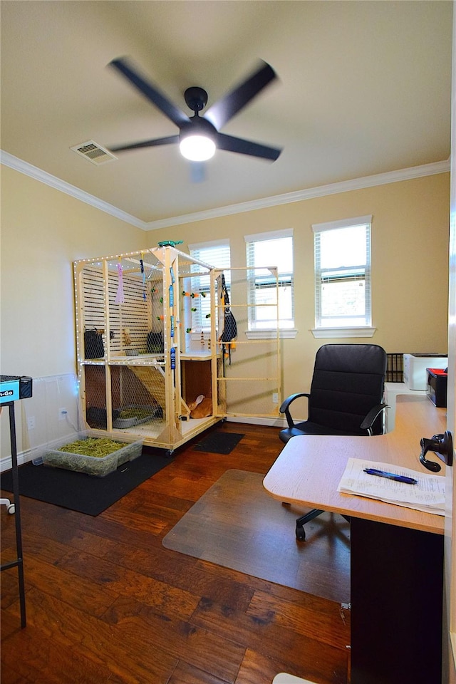 office space featuring ceiling fan, ornamental molding, wood finished floors, and visible vents