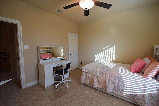 bedroom with light carpet, baseboards, visible vents, and a ceiling fan