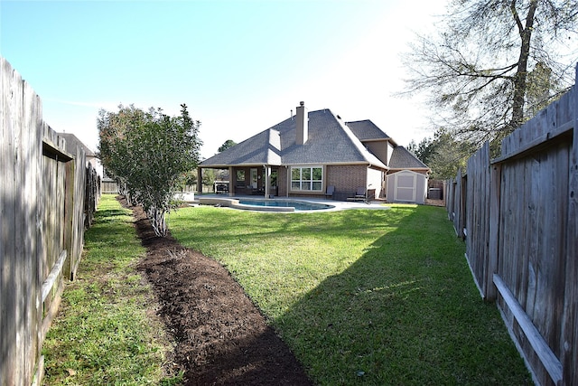 view of yard featuring a fenced backyard, an outdoor structure, a fenced in pool, a shed, and a patio area