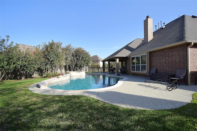 view of swimming pool with a fenced in pool, fence, a lawn, and a patio