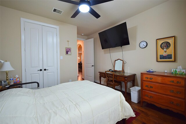 10010 Friesian Estates Dr, Spring, TX 77379 - bedroom with a closet, dark wood-style floors, ceiling fan, and arched walkways
