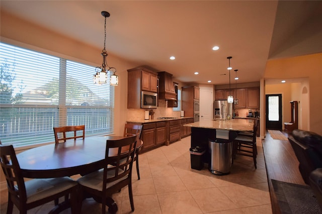 dining area featuring light tile patterned floors and recessed lighting