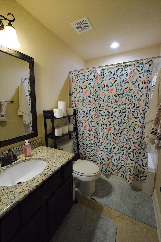 bathroom with toilet, vanity, visible vents, tile patterned floors, and shower / bathtub combination with curtain