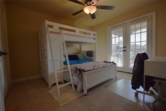 bedroom with light carpet, access to exterior, baseboards, and french doors