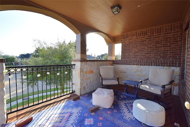 view of patio featuring a balcony