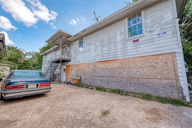 view of front of home featuring stairway