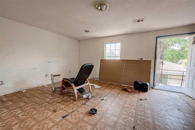 interior space featuring visible vents and a textured ceiling