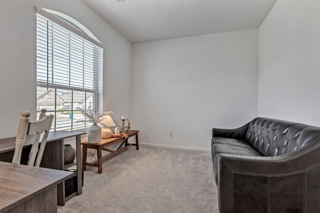 sitting room with light carpet and baseboards